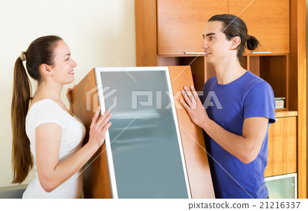 Family doing relocation of furniture Family doing relocation of furniture 21216337