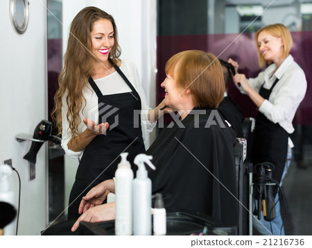 Elderly woman talking about cuts hair 21216736