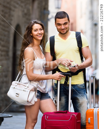 young travellers finding path with phone 21216749