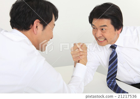 A businessman to arm sumo wrestling 21217536