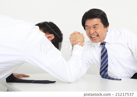 A businessman to arm sumo wrestling A businessman to arm sumo wrestling 21217537