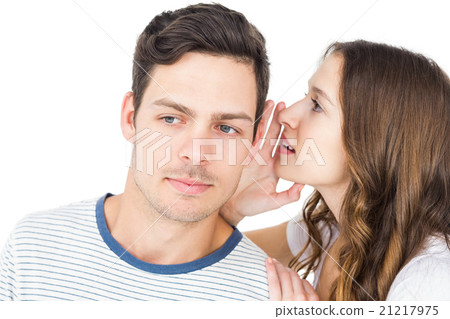 Young couple sharing a secret 21217975