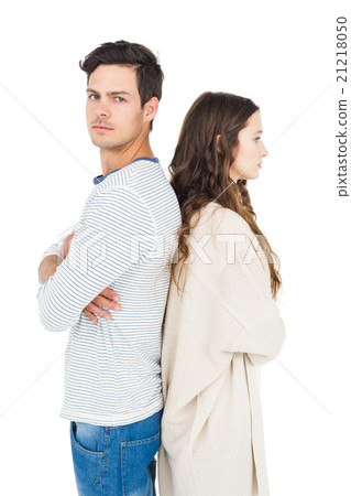 Couple standing back to back 21218050