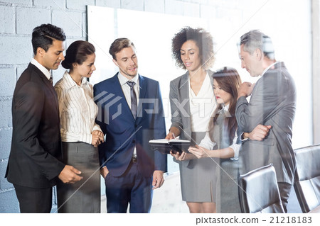 Businesspeople interacting in conference room Businesspeople interacting in conference room 21218183