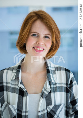 Red haired hipster smiling at camera Red haired hipster smiling at camera 21218648