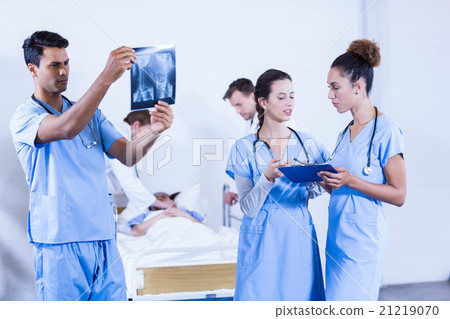 Doctor examining an x-ray in hospital Doctor examining an x-ray in hospital 21219070