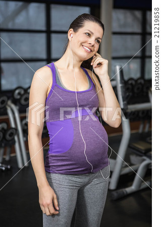 Pregnant woman listening to music 21219858