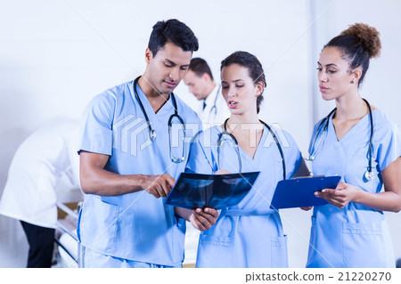 Doctor examining an x-ray in hospital 21220270