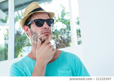Hipster man posing with sunglasses Hipster man posing with sunglasses 21220397