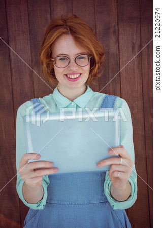 Red haired hipster using tablet Red haired hipster using tablet 21220974