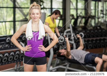 Fit woman posing with hands on hips Fit woman posing with hands on hips 21220976