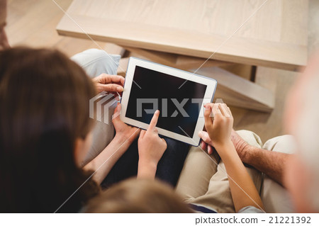 Children using tablet with their grandparents 21221392