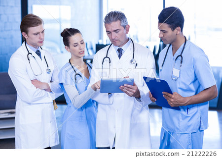 Doctors looking in digital tablet 21222226