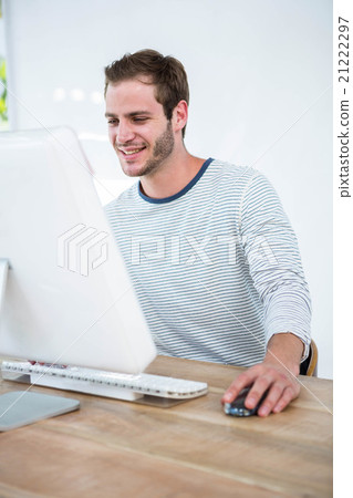 Handsome man working on computer Handsome man working on computer 21222297