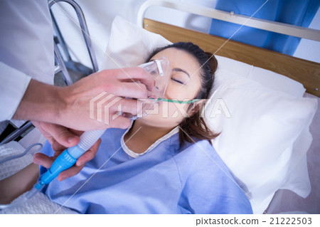 Doctor examining a patient on bed Doctor examining a patient on bed 21222503