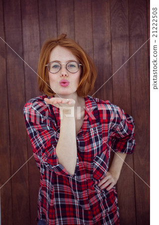 beautiful hipster woman blowing a kiss at the camera 21222508