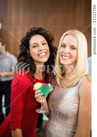 Portrait of beautiful women having drinks 21222566