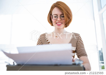 hipster typing on a typewrite hipster typing on a typewrite 21222593