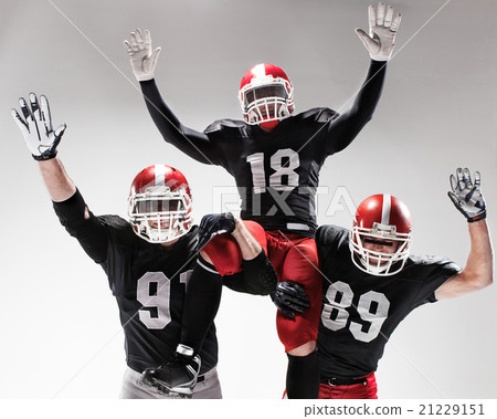 The three american football players posing on The three american football players posing on 21229151