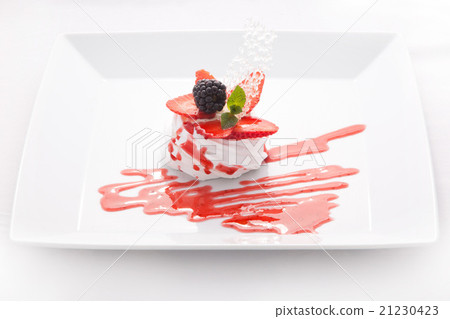 Mousse, cream, decorated with berries and jam 21230423