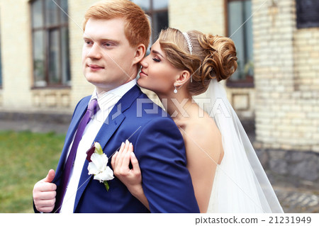 The bride groom gently embraced The bride groom gently embraced 21231949
