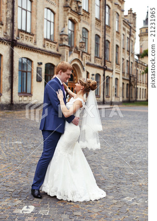 The bride groom gently embraced The bride groom gently embraced 21231965
