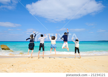 Young man who jumps at the beach Young man who jumps at the beach 21234121