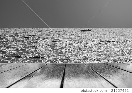 Fishing boats floating in the sea. 21237451