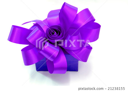 Gift box tied with a purple ribbon bow. Gift box tied with a purple ribbon bow. 21238155