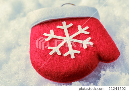Red christmas mitten with white snowflake Red christmas mitten with white snowflake 21241502