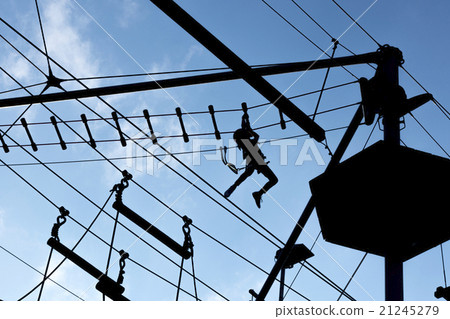 Person climbing on high ropes 21245279