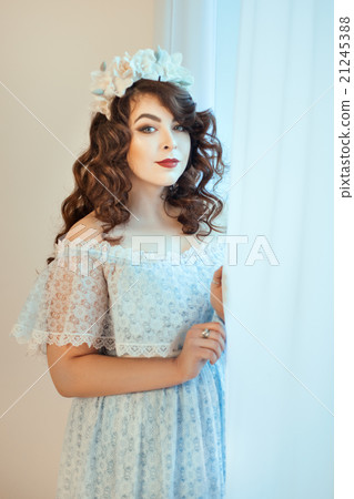 The woman at the window. 21245388