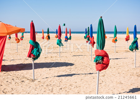 The famous colorful parasols on Deauville beach 21245661