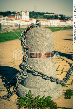 Stub posts linked in a chain on a quay Stub posts linked in a chain on a quay 21245746