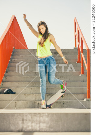 Girl on stairs with skateboard. 21246500