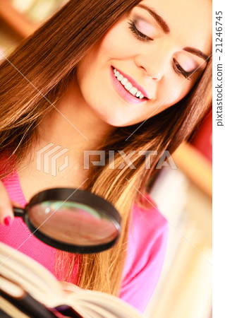 Girl holding magnifying glass Girl holding magnifying glass 21246745