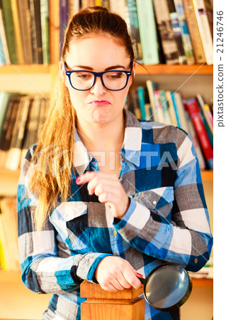 Girl holding magnifying glass Girl holding magnifying glass 21246746