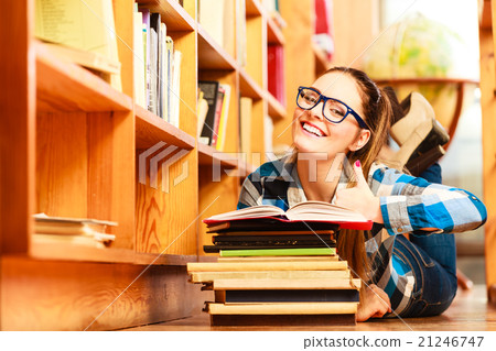 Woman student in college library Woman student in college library 21246747