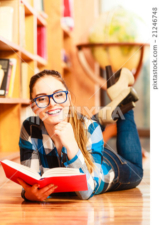 Woman student in college library Woman student in college library 21246748