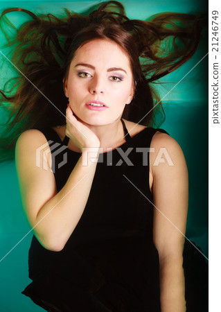 Sexy seductive woman in black dress in water. 21246749