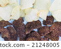 Chocalate and salt potato chips on blue background 21248005
