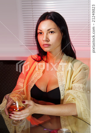 woman drinks brandy 21249823