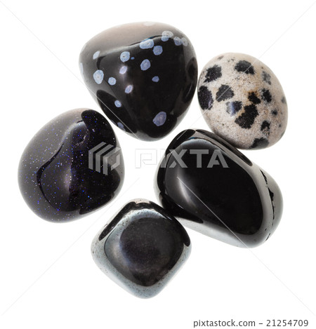 pile of black natural mineral gemstones isolated 21254709