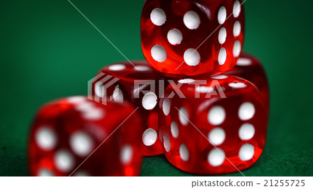 Red dice on a green felt 21255725