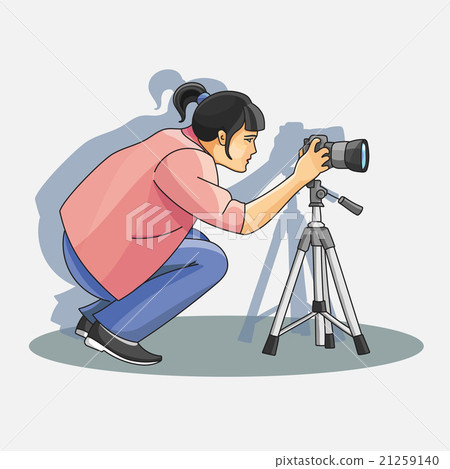 Young female photographer photographing Young female photographer photographing 21259140