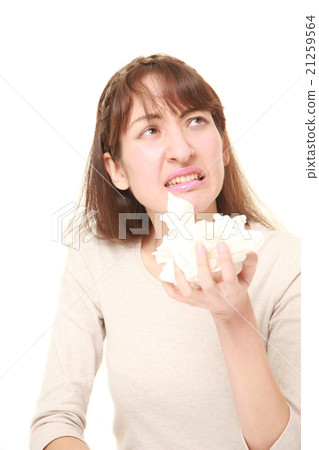 A woman suffering from hay fever 21259564