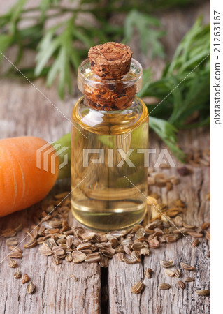 Medicated oil of carrot seeds in a glass bottle 21263167