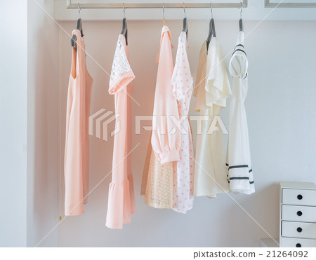 white closet with dress hanging white closet with dress hanging 21264092