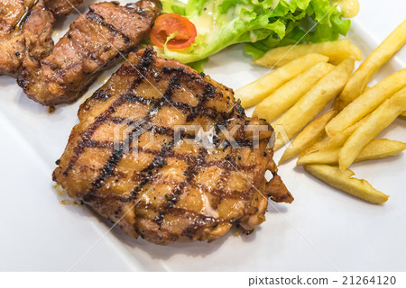 Grilled steak, French fries and vegetables Grilled steak, French fries and vegetables 21264120