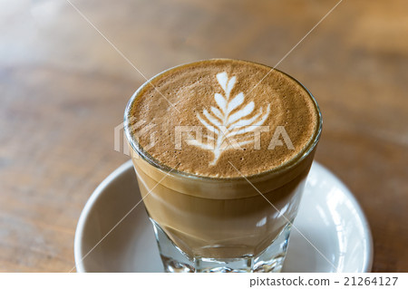 glass of latte coffee on wooden table glass of latte coffee on wooden table 21264127